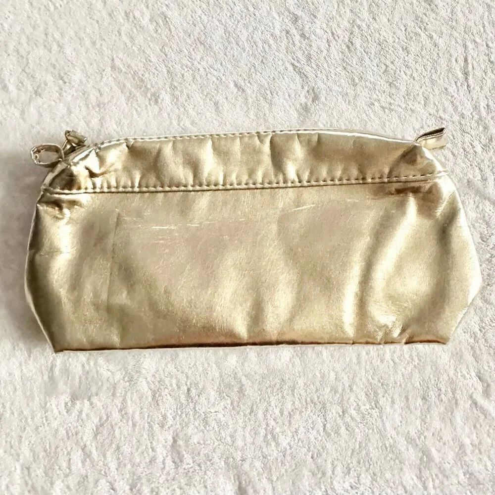 White gold Clarins cosmetic zip up bag